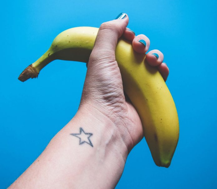 Hand holding banana
